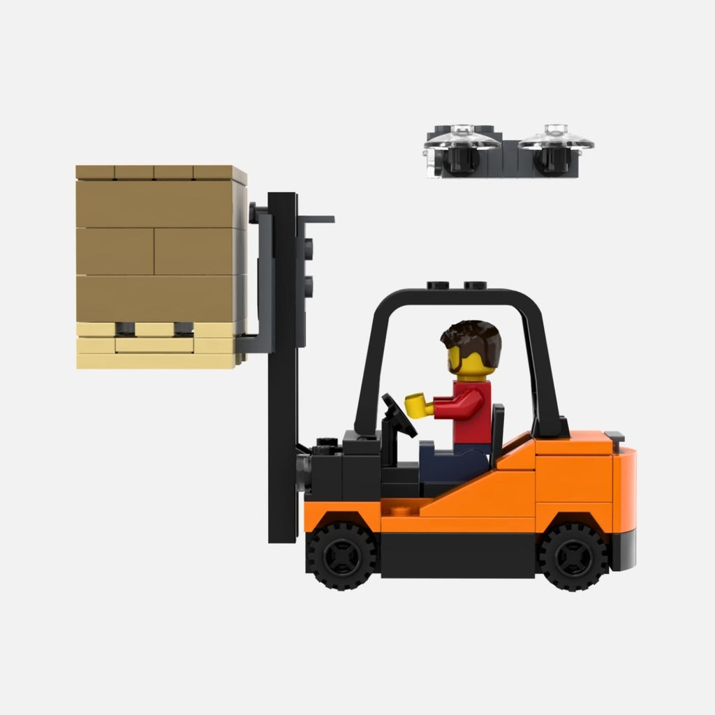 A LEGO set showing an orange and black forklift with a minifigure driver, carrying a tan palletized cargo box, with a small gray drone floating above